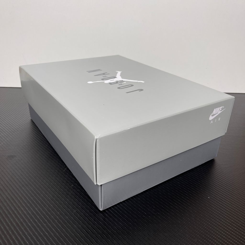 Side profile of the Air Jordan 11 Retro 'Cool Grey' (2021), showcasing the premium nubuck upper, signature high-cut grey patent leather mudguard, and white Phylon midsole.