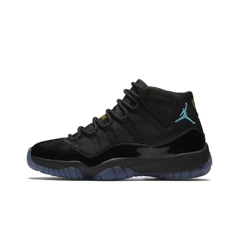 Side profile of the Air Jordan 11 Retro 'Gamma Blue' (2025), showcasing the all-black ballistic mesh upper, glossy high-cut patent leather mudguard, and black Phylon midsole.