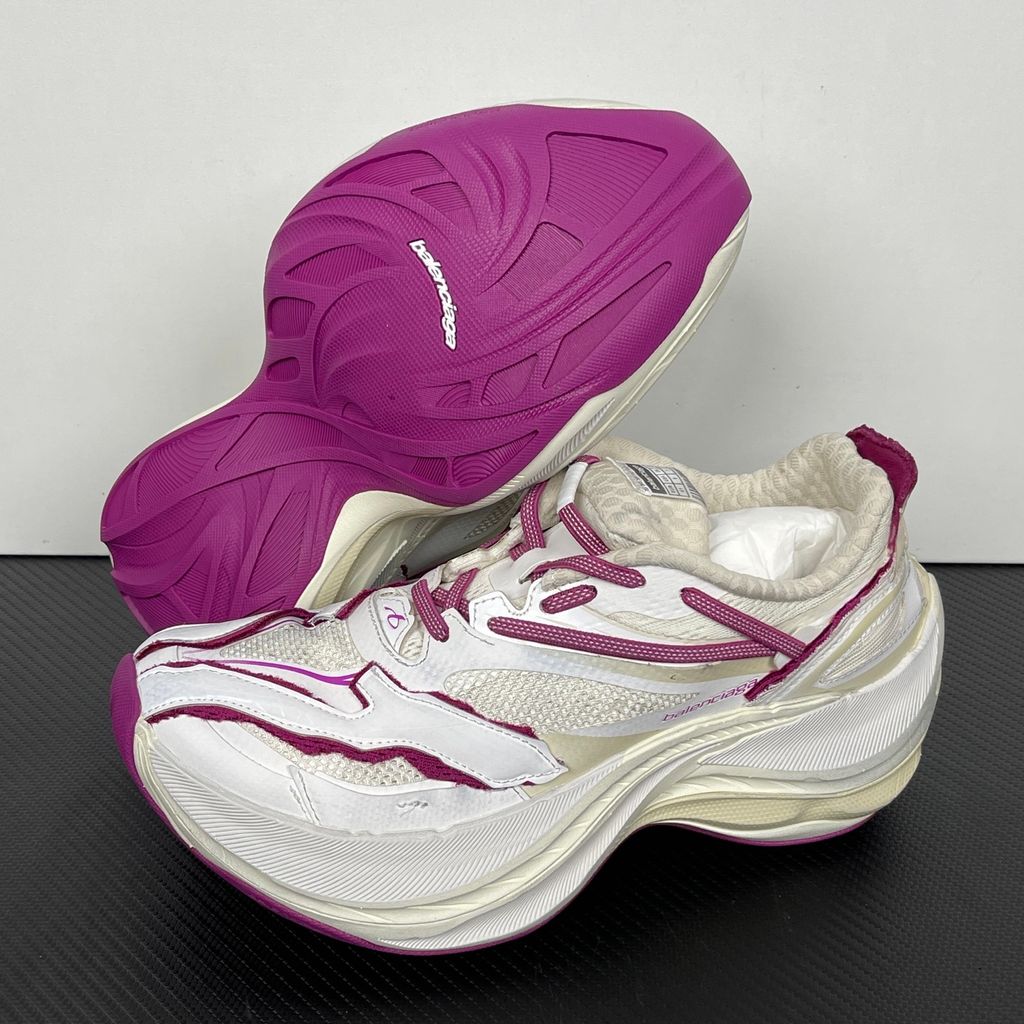 Side profile of the Balenciaga Jet low-top sneaker, showcasing the complex layered construction, white mesh and synthetic upper with vibrant purple and red accents, and the prominent 4.25cm thick platform sole.