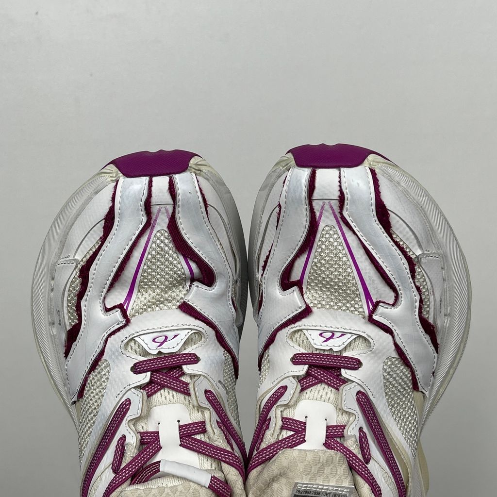 Side profile of the Balenciaga Jet low-top sneaker, showcasing the complex layered construction, white mesh and synthetic upper with vibrant purple and red accents, and the prominent 4.25cm thick platform sole.