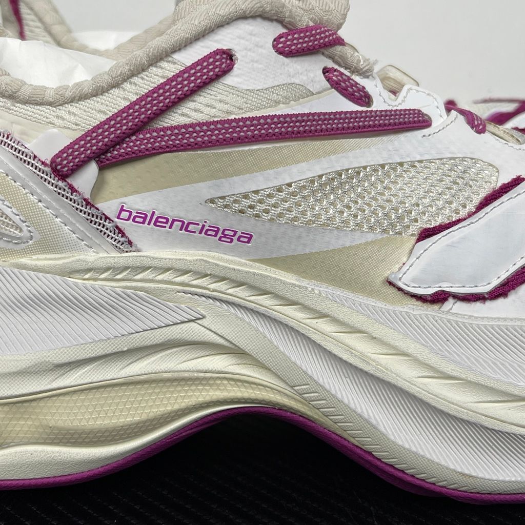 Side profile of the Balenciaga Jet low-top sneaker, showcasing the complex layered construction, white mesh and synthetic upper with vibrant purple and red accents, and the prominent 4.25cm thick platform sole.