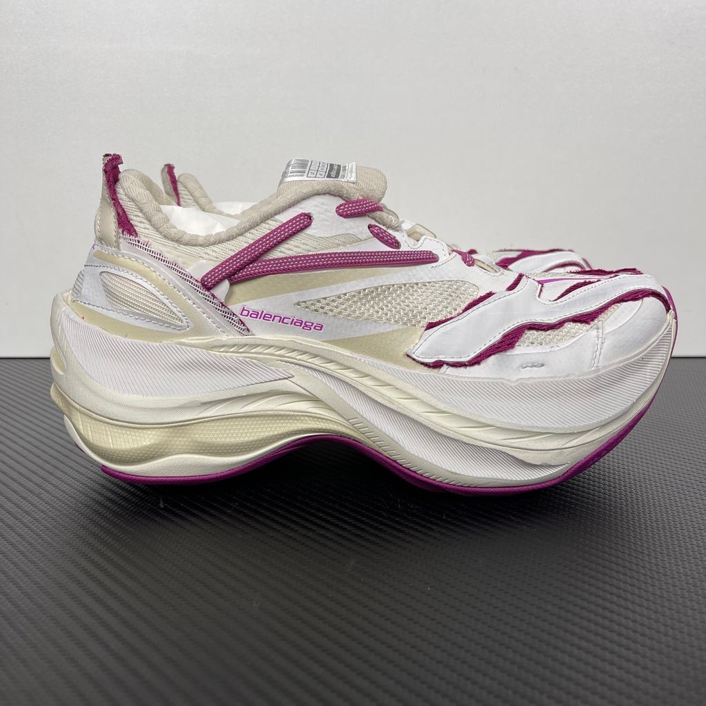 Side profile of the Balenciaga Jet low-top sneaker, showcasing the complex layered construction, white mesh and synthetic upper with vibrant purple and red accents, and the prominent 4.25cm thick platform sole.