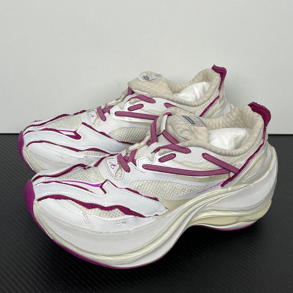 Side profile of the Balenciaga Jet low-top sneaker, showcasing the complex layered construction, white mesh and synthetic upper with vibrant purple and red accents, and the prominent 4.25cm thick platform sole.