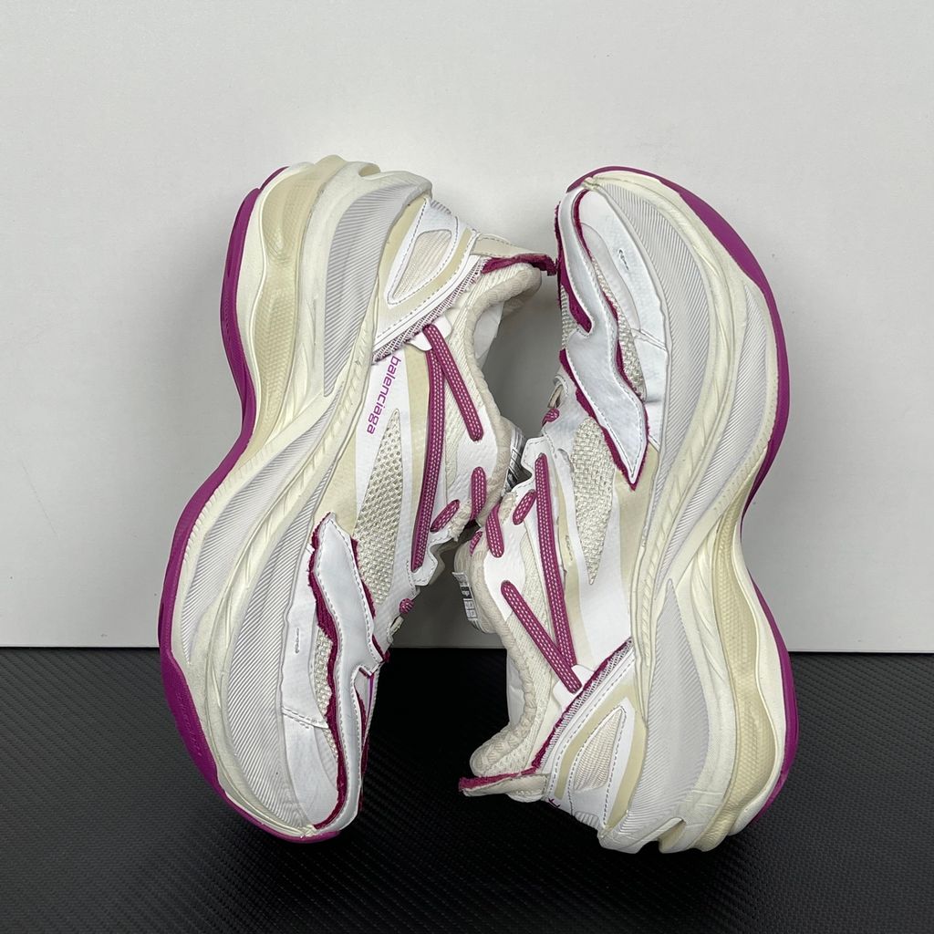 Side profile of the Balenciaga Jet low-top sneaker, showcasing the complex layered construction, white mesh and synthetic upper with vibrant purple and red accents, and the prominent 4.25cm thick platform sole.