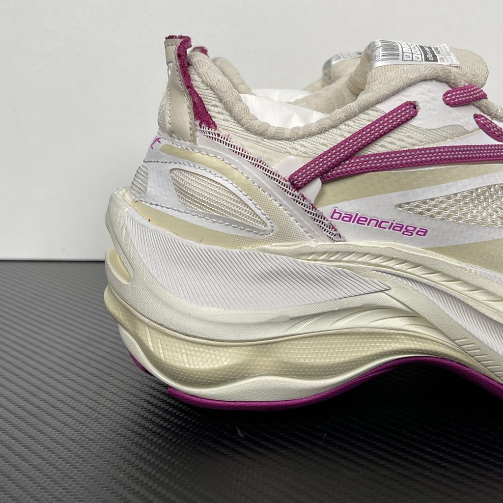 Side profile of the Balenciaga Jet low-top sneaker, showcasing the complex layered construction, white mesh and synthetic upper with vibrant purple and red accents, and the prominent 4.25cm thick platform sole.