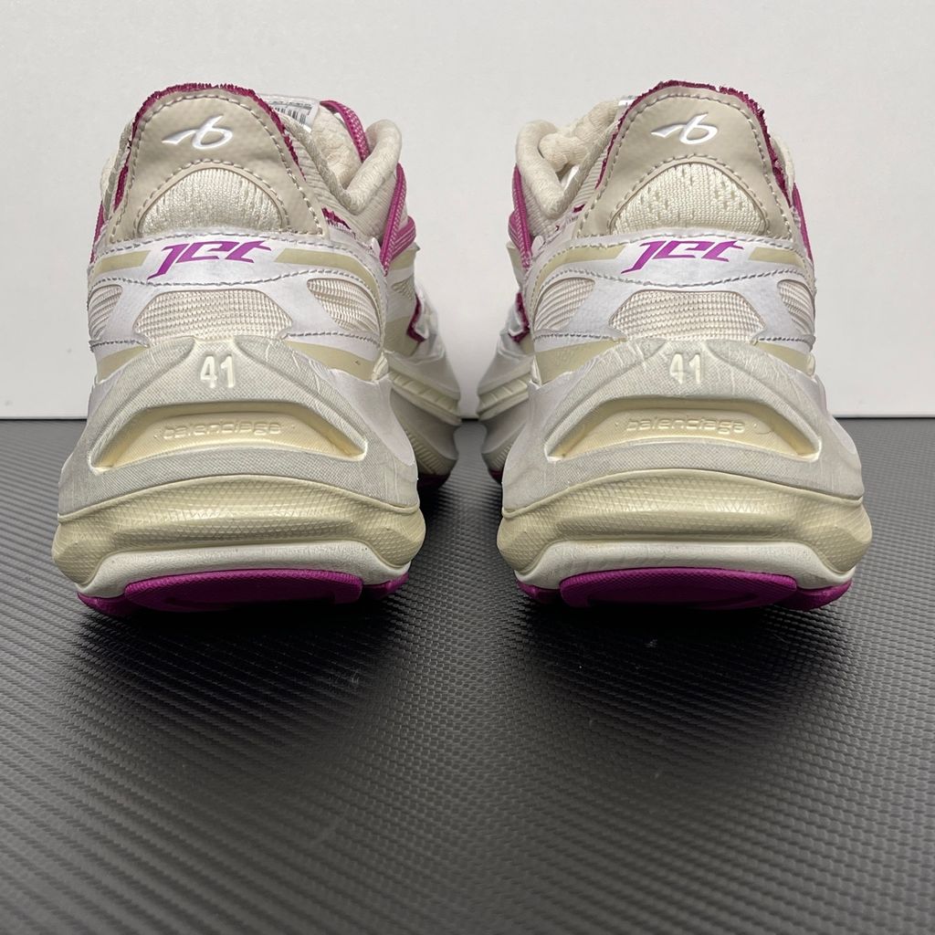 Side profile of the Balenciaga Jet low-top sneaker, showcasing the complex layered construction, white mesh and synthetic upper with vibrant purple and red accents, and the prominent 4.25cm thick platform sole.