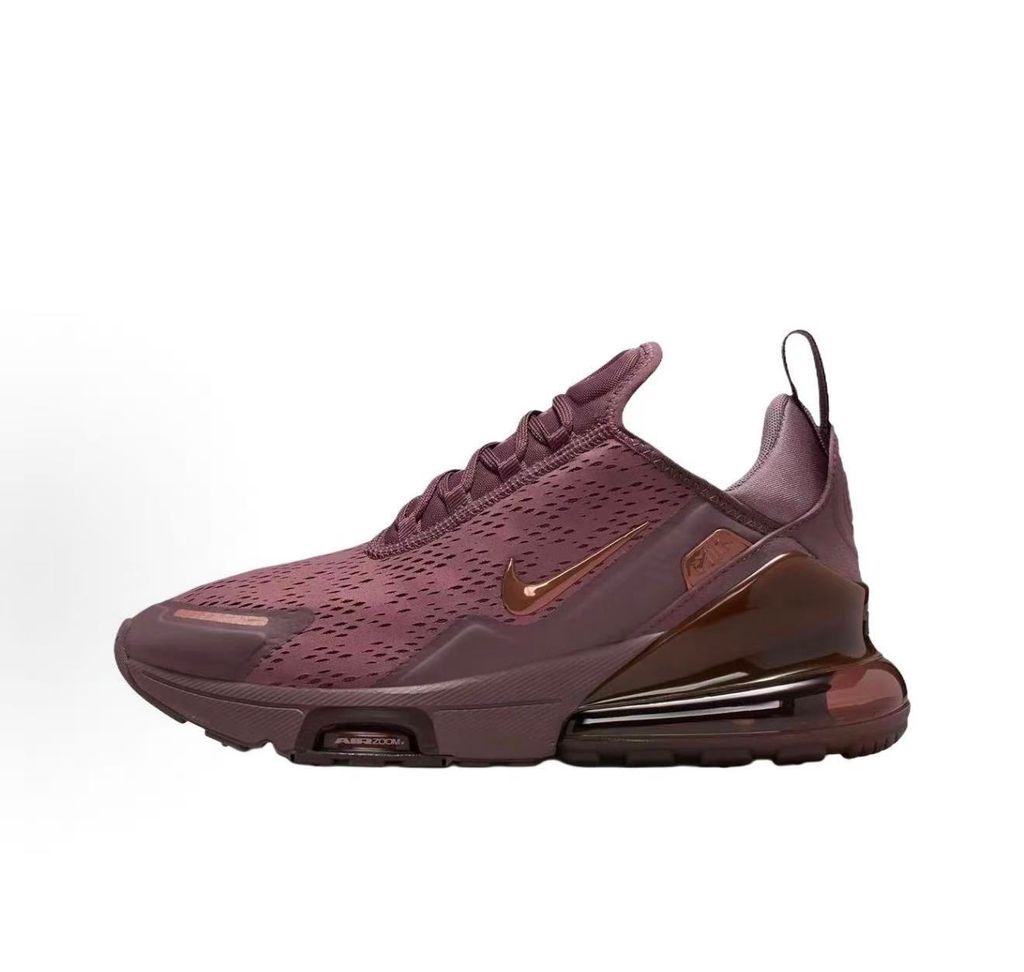 Side profile of the Nike Air Max 270 Premium 'Tattoo' in Metallic Red Bronze, showcasing the shimmering metallic upper, detailed tattoo-inspired graphic overlays, and the massive translucent Max Air unit.