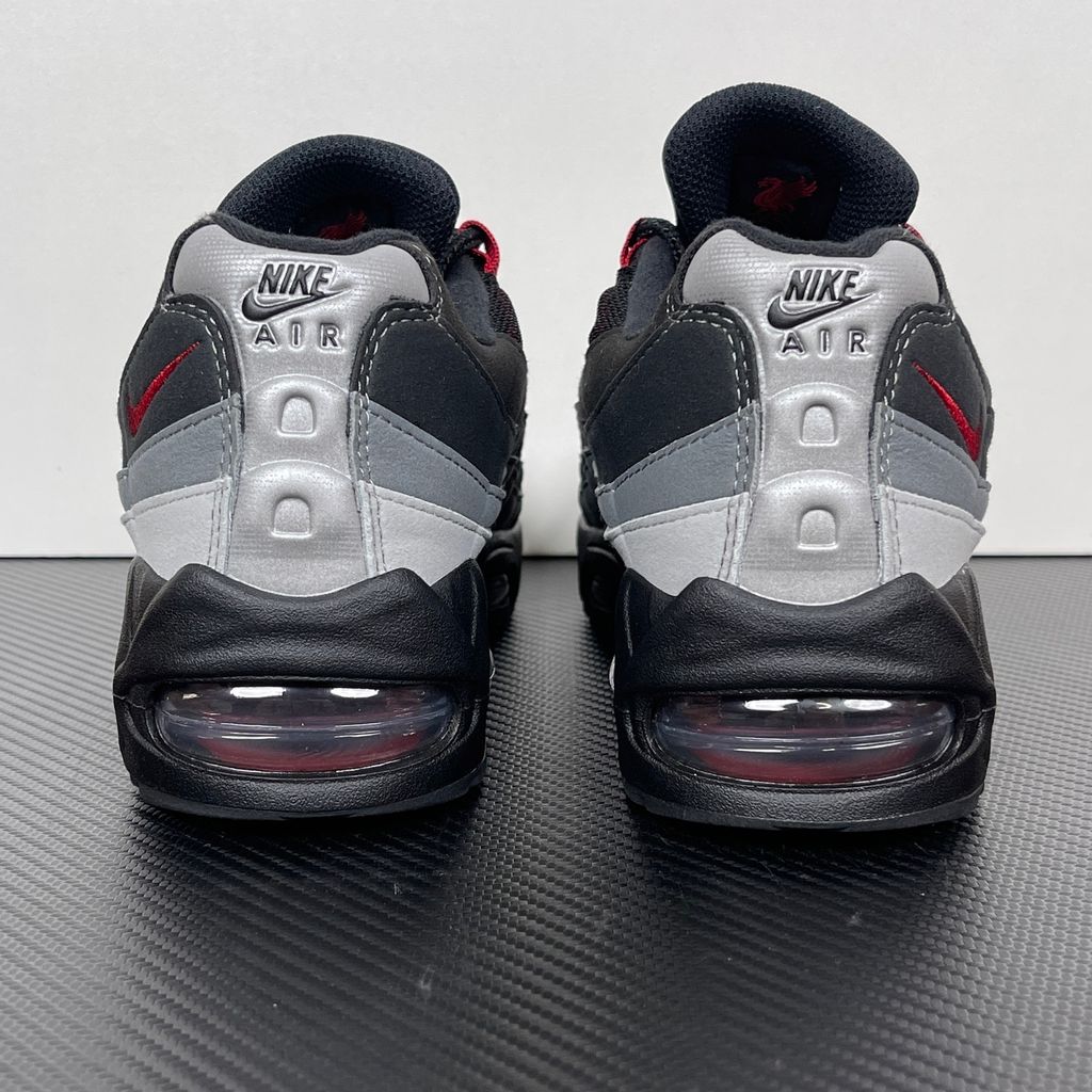 Side profile of the Nike Air Max 95 OG 'Big Bubble' x Liverpool F.C., showcasing the signature anatomy-inspired gradient upper, subtle club-inspired color accents, and the enlarged visible Air unit in the heel.