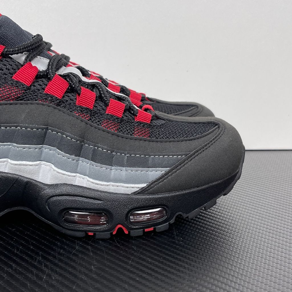 Side profile of the Nike Air Max 95 OG 'Big Bubble' x Liverpool F.C., showcasing the signature anatomy-inspired gradient upper, subtle club-inspired color accents, and the enlarged visible Air unit in the heel.
