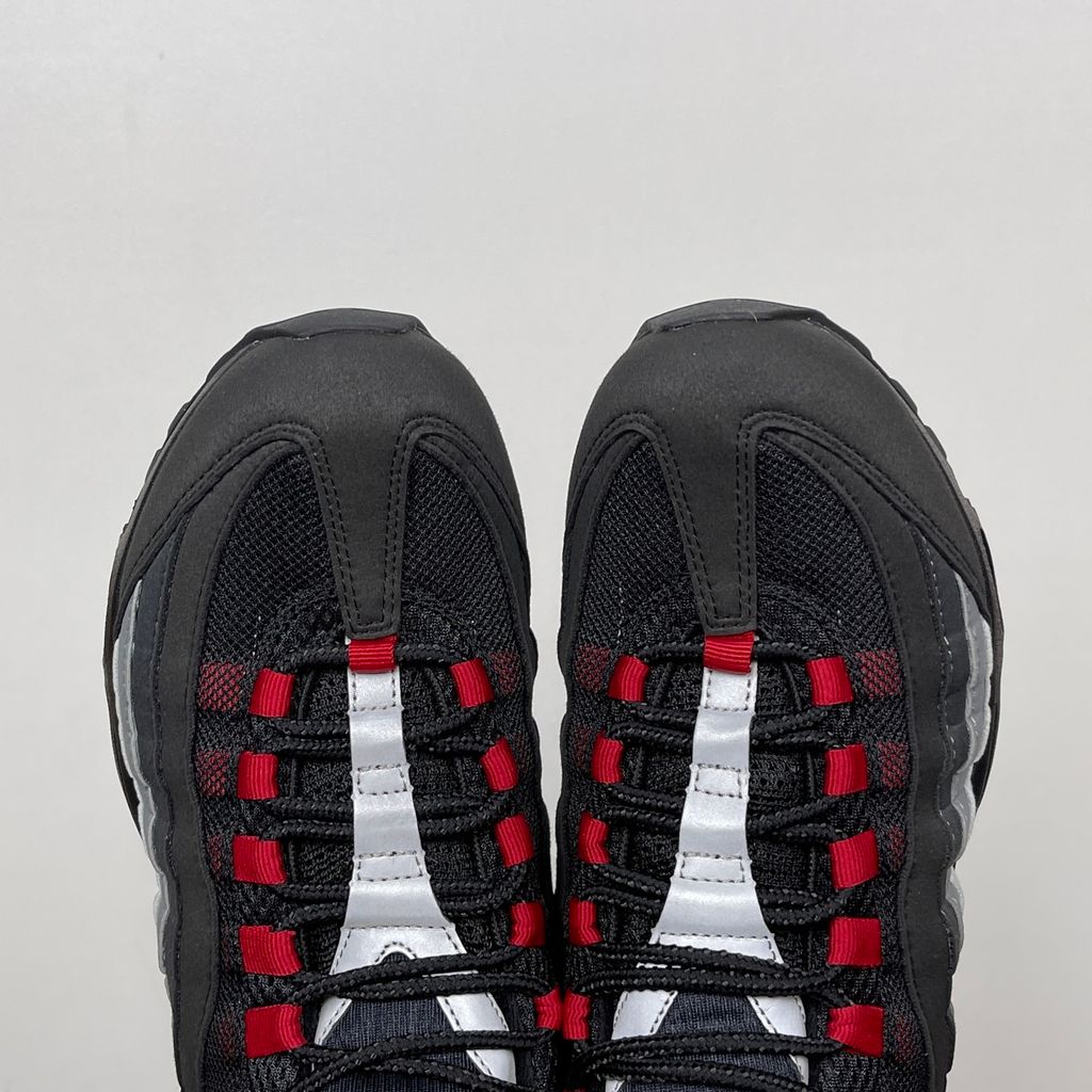 Side profile of the Nike Air Max 95 OG 'Big Bubble' x Liverpool F.C., showcasing the signature anatomy-inspired gradient upper, subtle club-inspired color accents, and the enlarged visible Air unit in the heel.