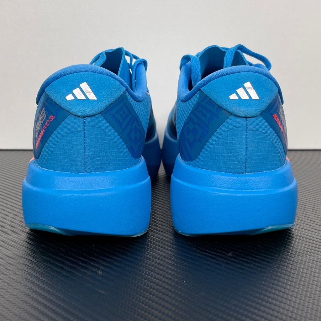 Side profile of the adidas Adizero Evo SL 'Ekiden' in a vibrant Solar Blue colorway, showcasing the breathable mesh upper, prominent Silver Metallic 3-Stripes branding, and the responsive Lightstrike Pro cushioned midsole.