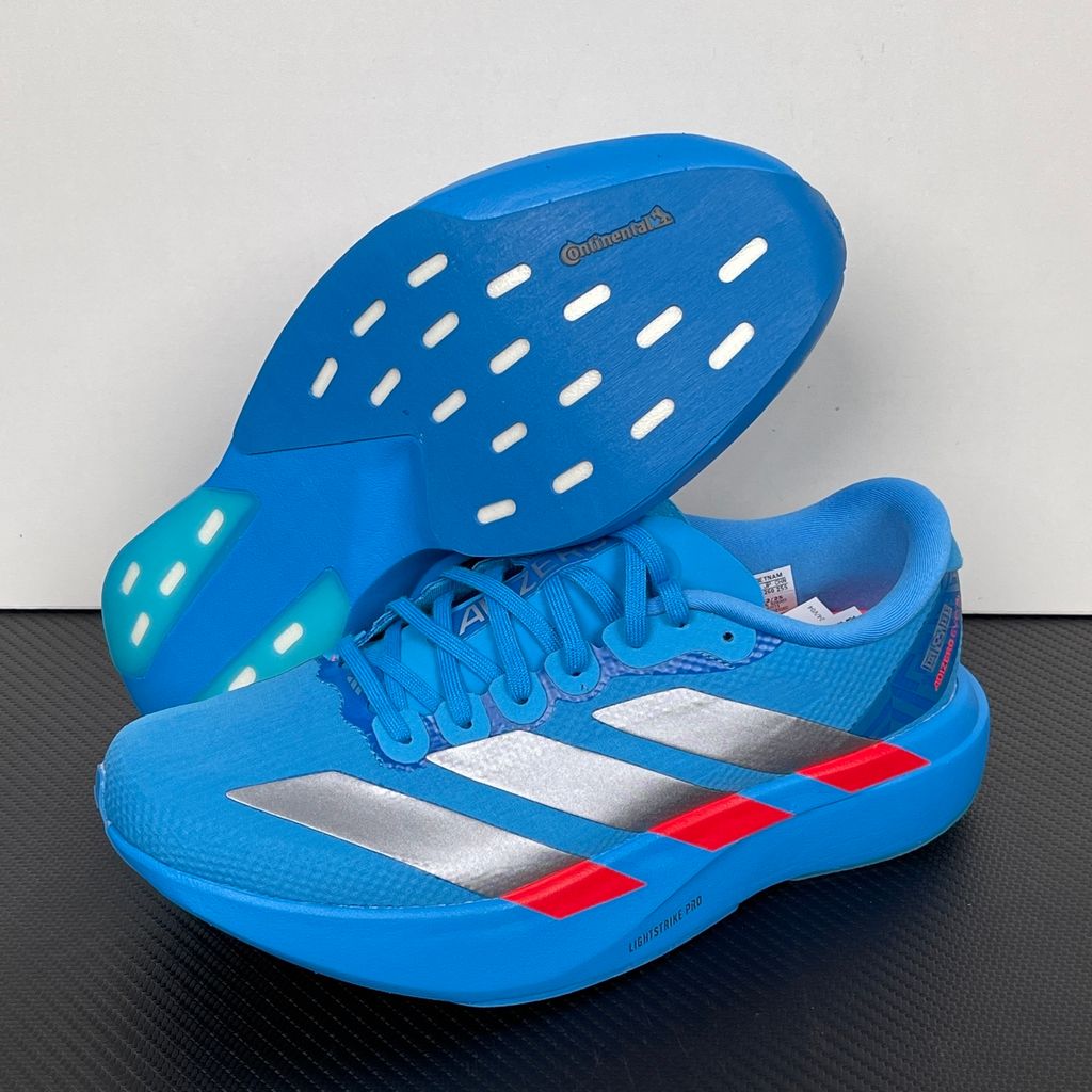 Side profile of the adidas Adizero Evo SL 'Ekiden' in a vibrant Solar Blue colorway, showcasing the breathable mesh upper, prominent Silver Metallic 3-Stripes branding, and the responsive Lightstrike Pro cushioned midsole.