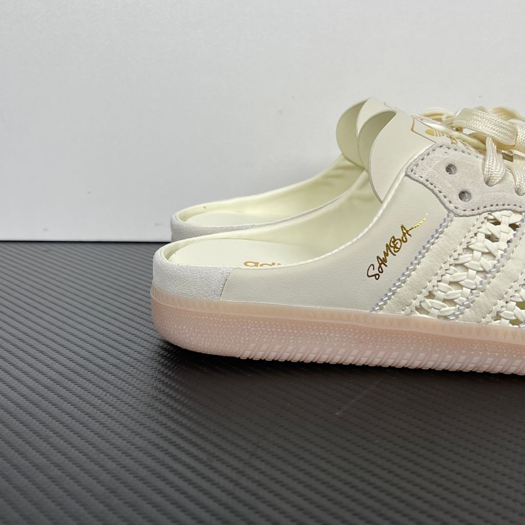 Side profile of the adidas Samba OG Mule W in Cream White, showcasing the backless slip-on silhouette, intricate woven side panels replacing the traditional 3-Stripes, premium suede T-toe, and light gum rubber outsole.