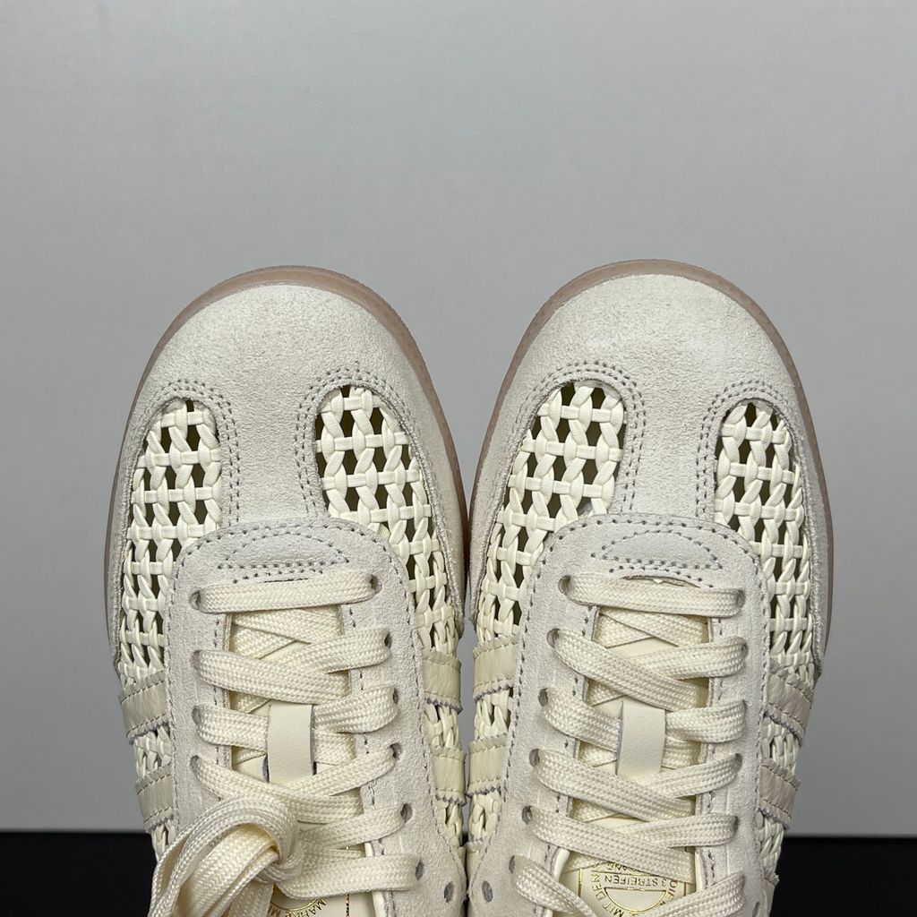 Side profile of the adidas Samba OG Mule W in Cream White, showcasing the backless slip-on silhouette, intricate woven side panels replacing the traditional 3-Stripes, premium suede T-toe, and light gum rubber outsole.