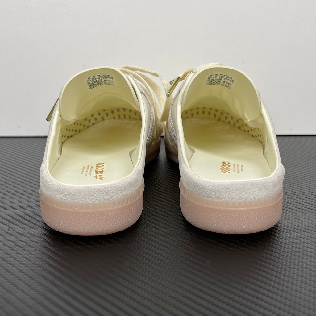 Side profile of the adidas Samba OG Mule W in Cream White, showcasing the backless slip-on silhouette, intricate woven side panels replacing the traditional 3-Stripes, premium suede T-toe, and light gum rubber outsole.