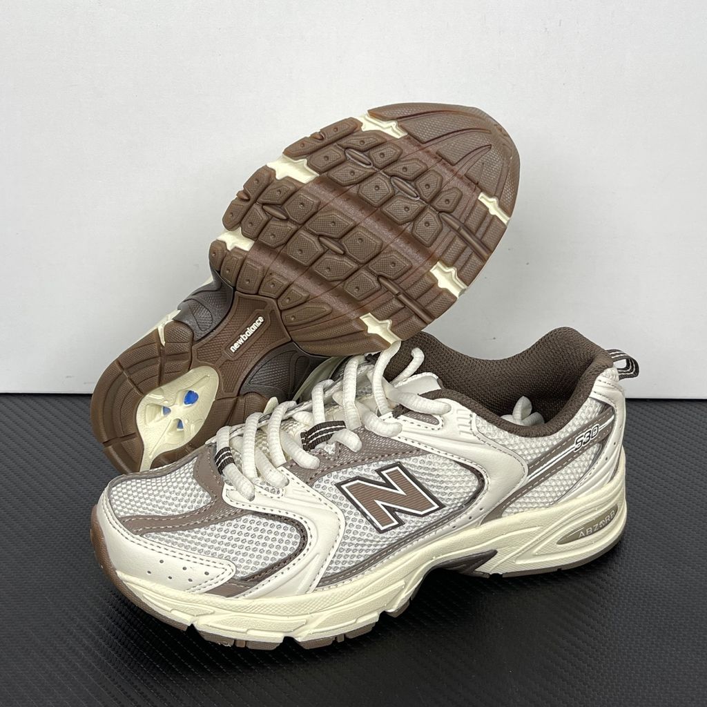 Side profile of the New Balance 530 'Turtledove Mushroom', showcasing the breathable cream mesh upper, earthy mushroom brown synthetic overlays, classic 'N' logo, and the chunky ABZORB cushioned midsole.