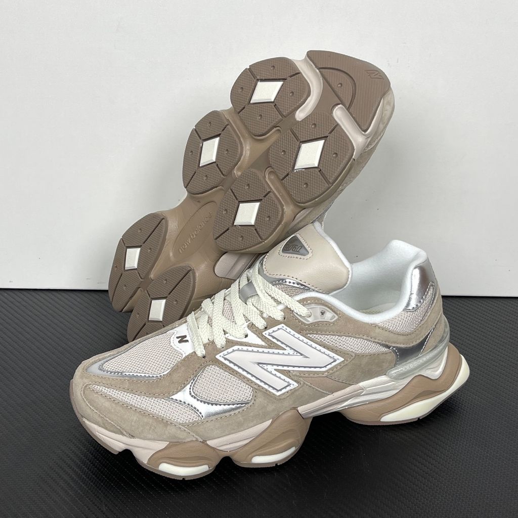 Side profile of the New Balance 9060 'Moonbeam Driftwood', showcasing the breathable cream mesh upper, rich earthy brown suede overlays, the classic silver metallic 'N' logo, and the exaggerated, sculpted ABZORB and SBS cushioned midsole.