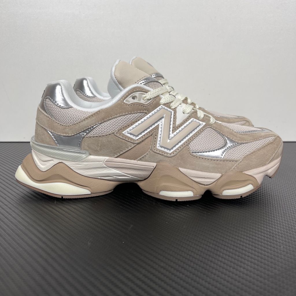 Side profile of the New Balance 9060 'Moonbeam Driftwood', showcasing the breathable cream mesh upper, rich earthy brown suede overlays, the classic silver metallic 'N' logo, and the exaggerated, sculpted ABZORB and SBS cushioned midsole.