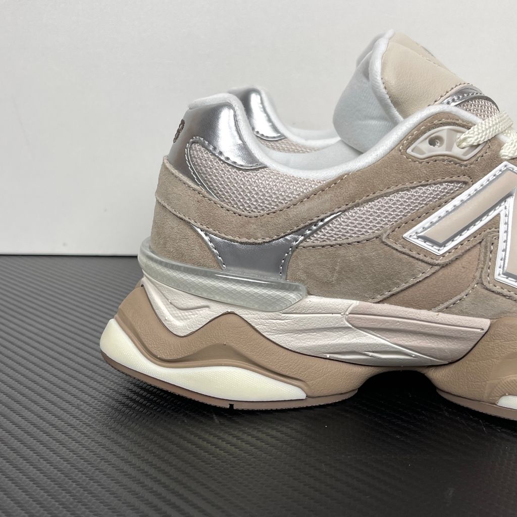Side profile of the New Balance 9060 'Moonbeam Driftwood', showcasing the breathable cream mesh upper, rich earthy brown suede overlays, the classic silver metallic 'N' logo, and the exaggerated, sculpted ABZORB and SBS cushioned midsole.