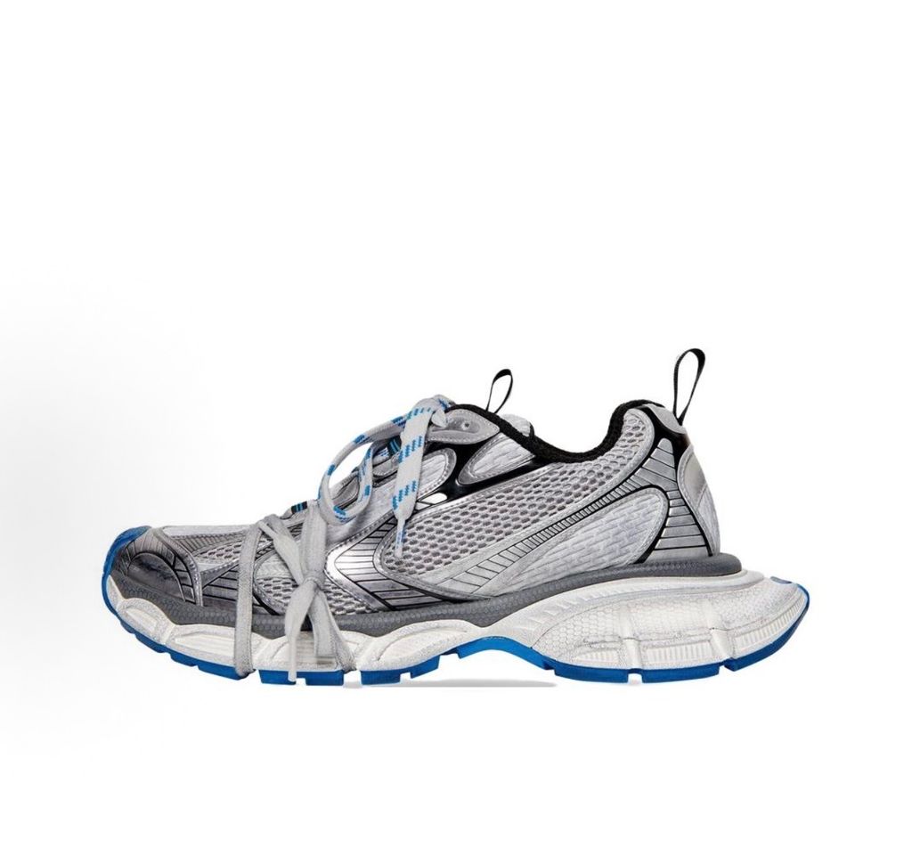 Side profile of the Balenciaga 3XL "Worn-Out Grey Blue" sneaker, highlighting the signature distressed finish, intricate layered mesh and synthetic overlays, and the exaggerated, sculpted chunky midsole.