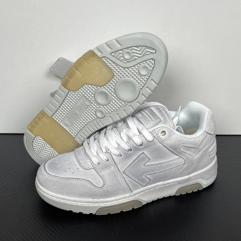 Side profile of the Off-White Out Of Office sneaker in Light Grey, showcasing the tonal distressed suede upper, signature Arrow logo, leather tag detail on the laces, and a white midsole featuring translucent gel inserts.