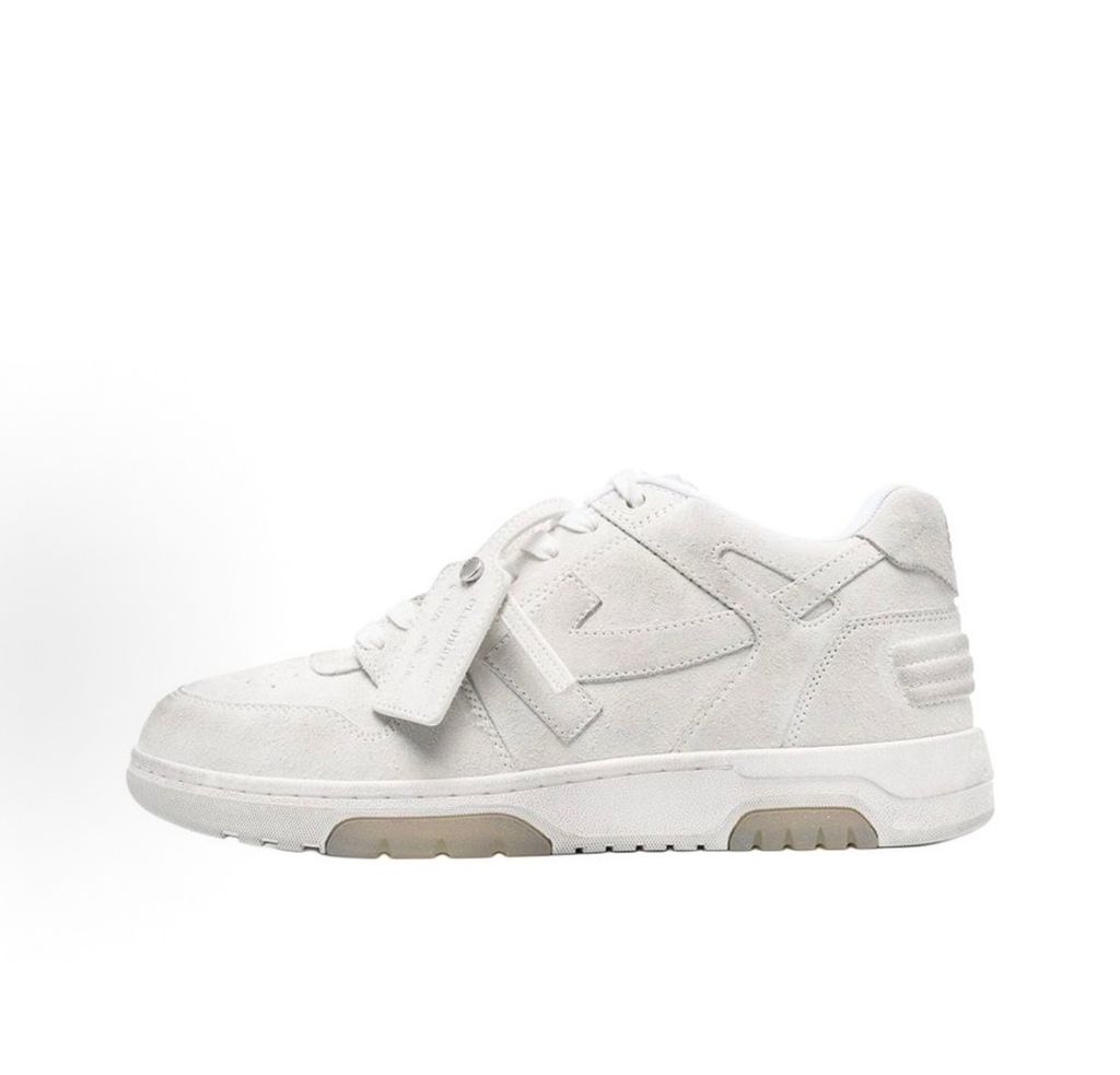Side profile of the Off-White Out Of Office sneaker in Light Grey, showcasing the tonal distressed suede upper, signature Arrow logo, leather tag detail on the laces, and a white midsole featuring translucent gel inserts.