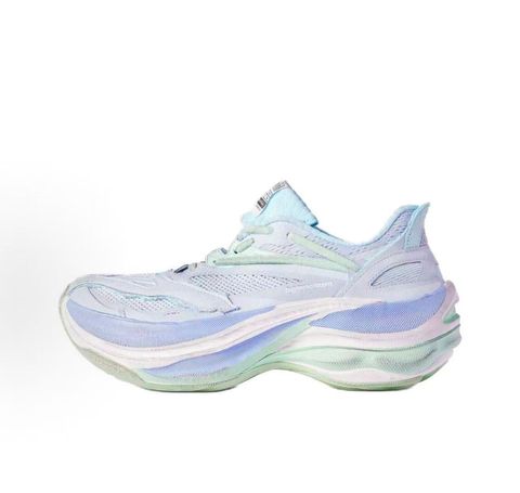 Side profile of the Balenciaga Jet Sneaker, showcasing the pastel light blue, lilac, and mint green layered mesh upper with heavy distressing and frayed edges, seated on a massively chunky, aerodynamic rocker-shaped midsole.