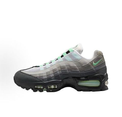 Side profile of the women's Nike Air Max 95 OG 'Big Bubble' Fresh Mint, showcasing the classic grey gradient anatomy-inspired upper, vibrant mint green lace loops and Swoosh, and the exaggerated visible Air units housed within a black midsole.