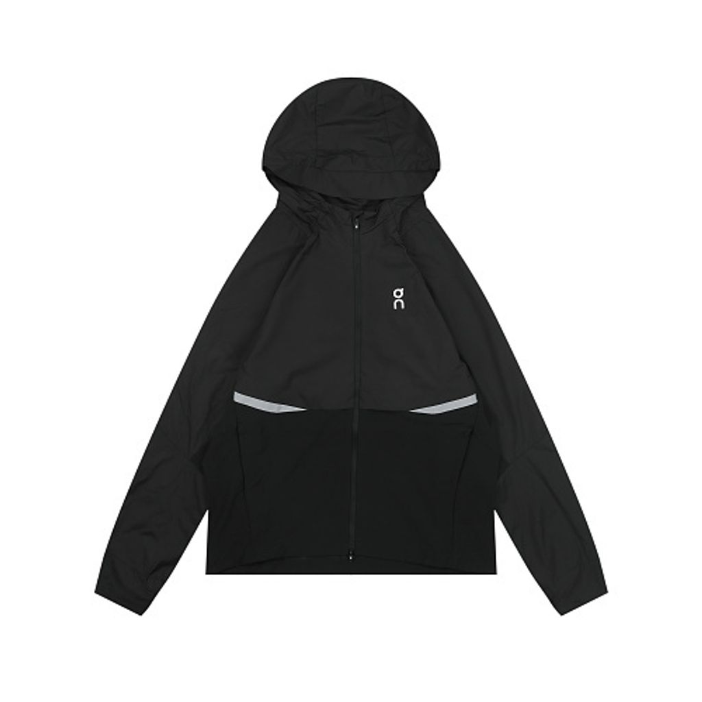 Front profile of the men's On Running Core Jacket in black, showcasing the lightweight windproof fabric, full-length front zipper, protective hood, white 'On' logo, and sleek reflective strips across the midsection for night safety.