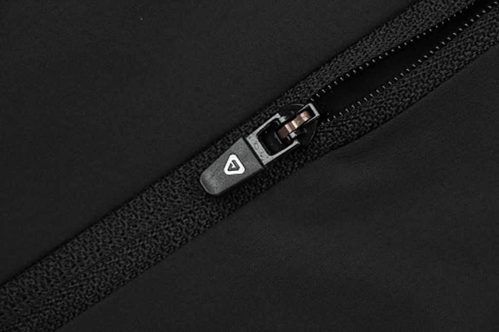 Front profile of the men's On Running Core Jacket in black, showcasing the lightweight windproof fabric, full-length front zipper, protective hood, white 'On' logo, and sleek reflective strips across the midsection for night safety.