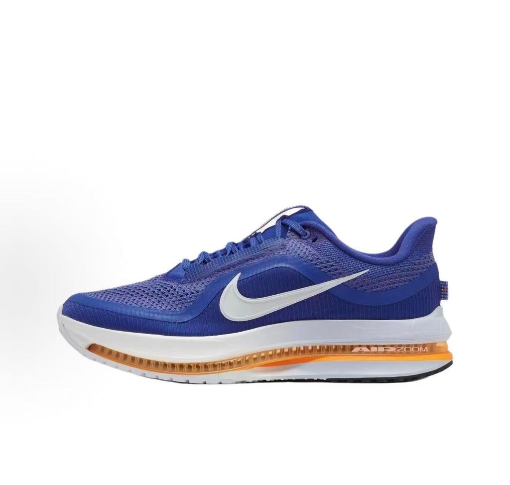 Side profile of the Nike Air Zoom Pegasus Premium, showcasing the vibrant Lapis blue engineered mesh upper, crisp white Nike Swoosh, energetic Total Orange accents, and the groundbreaking sculpted visible Zoom Air unit running through the midsole.