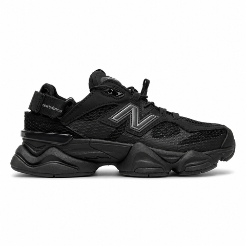 Side profile of the New Balance 9060 sneaker in the 'Summer Black' colorway, showcasing the retro-futuristic chunky midsole, black breathable mesh upper with tonal suede overlays, and the signature metallic 'N' logo on the side panel.