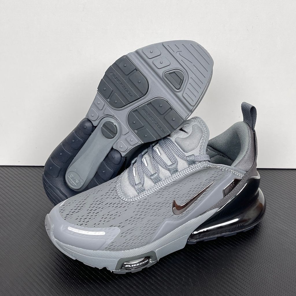 Side profile of the Nike Air Max 270 Premium sneaker in a sleek 'Smoke Grey' colorway, showcasing the upgraded breathable upper, tonal synthetic overlays, and the massive, signature translucent 270-degree Max Air heel unit.