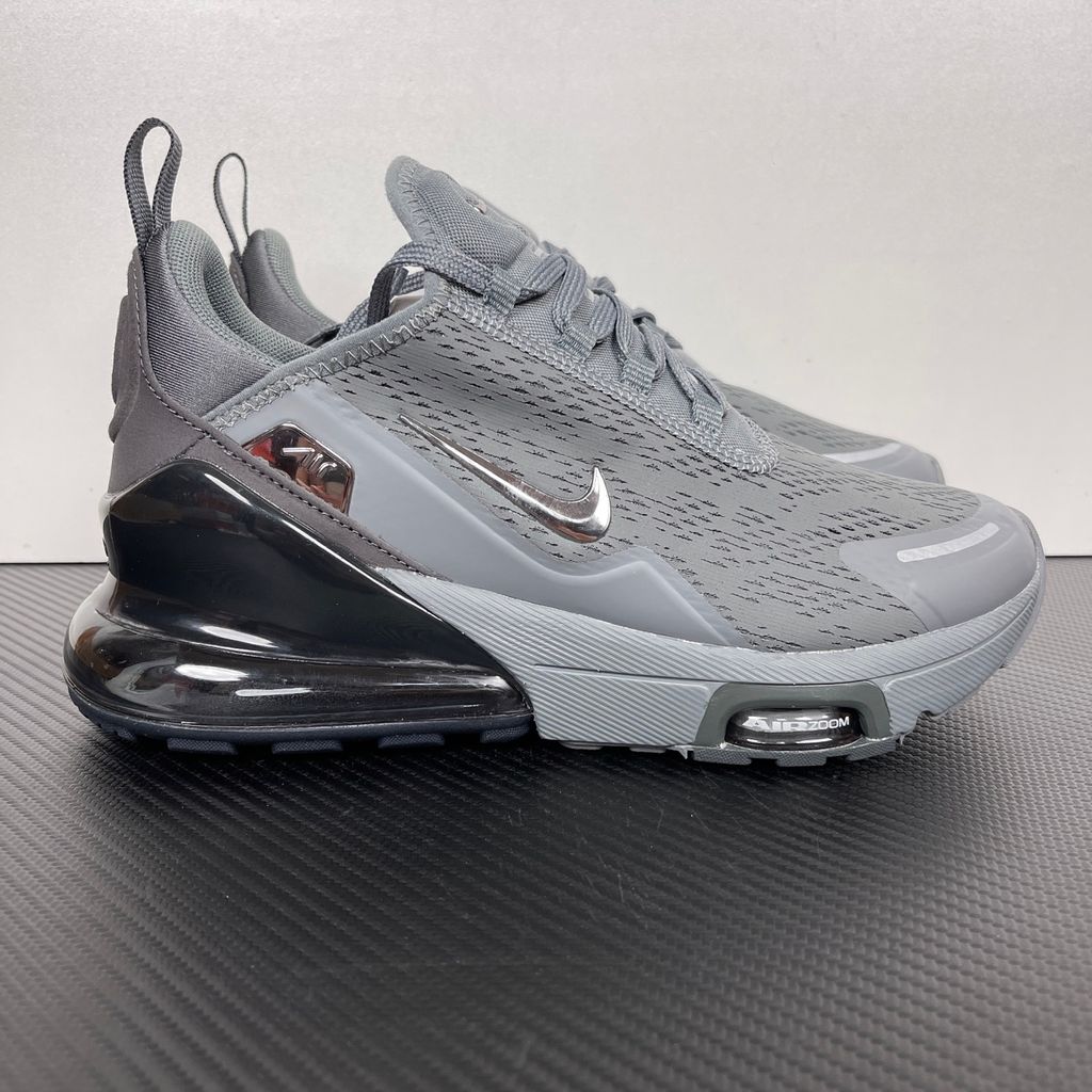Side profile of the Nike Air Max 270 Premium sneaker in a sleek 'Smoke Grey' colorway, showcasing the upgraded breathable upper, tonal synthetic overlays, and the massive, signature translucent 270-degree Max Air heel unit.