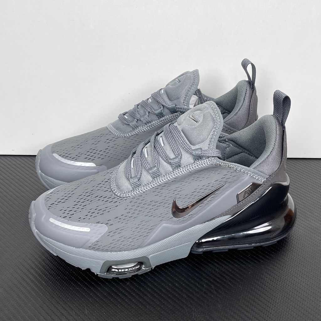 Side profile of the Nike Air Max 270 Premium sneaker in a sleek 'Smoke Grey' colorway, showcasing the upgraded breathable upper, tonal synthetic overlays, and the massive, signature translucent 270-degree Max Air heel unit.