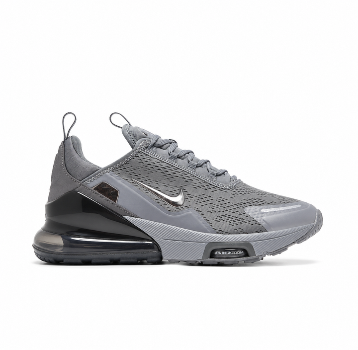 Side profile of the Nike Air Max 270 Premium sneaker in a sleek 'Smoke Grey' colorway, showcasing the upgraded breathable upper, tonal synthetic overlays, and the massive, signature translucent 270-degree Max Air heel unit.