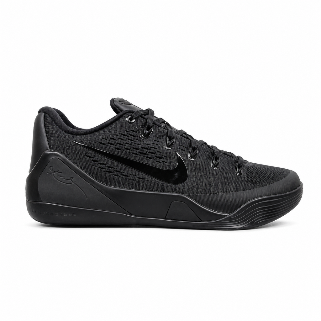 Side profile of the Nike Kobe 9 EM Low Protro TB sneaker in a monochromatic 'Triple Black' colorway, showcasing the stealthy Engineered Mesh upper, tonal black Swoosh, carbon fiber heel counter, and the signature black pressure-mapped outsole.