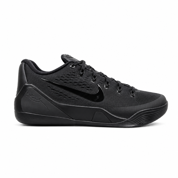 Side profile of the Nike Kobe 9 EM Low Protro TB sneaker in a monochromatic 'Triple Black' colorway, showcasing the stealthy Engineered Mesh upper, tonal black Swoosh, carbon fiber heel counter, and the signature black pressure-mapped outsole.