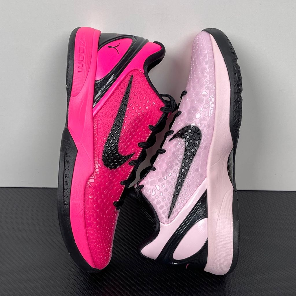 Side profile of the Nike Kobe 6 Protro 'Kay Yow Think Pink' 2026 sneaker, showcasing the vibrant pink snake-scale textured upper, contrasting white Swoosh, signature Kay Yow ribbon detailing on the heel, and the supportive heel counter.