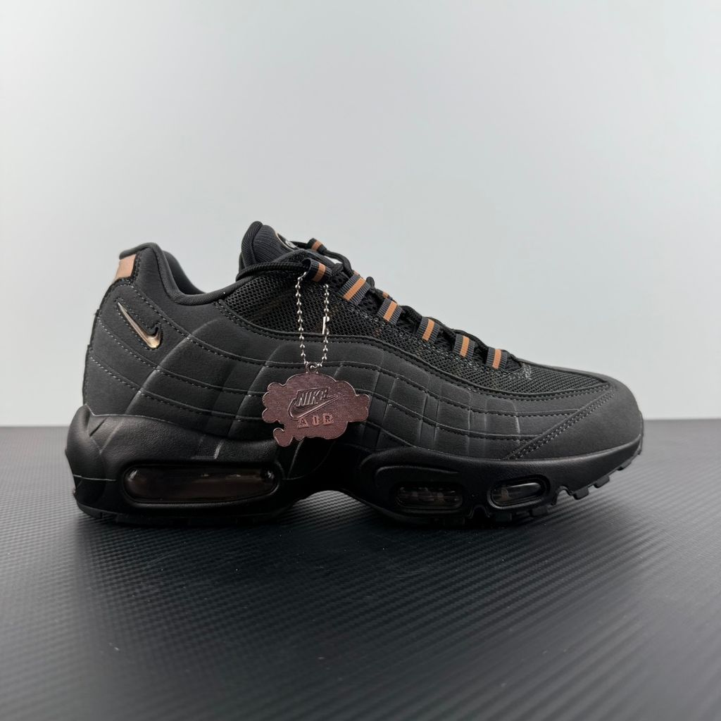 Side profile of the Nike Air Max 95 Central Cee 'Live Yours' sneaker, showcasing the UK drill-inspired dark and metallic layered upper, reflective 3M detailing, exclusive branding, and the signature visible Max Air cushioning units in the black midsole.