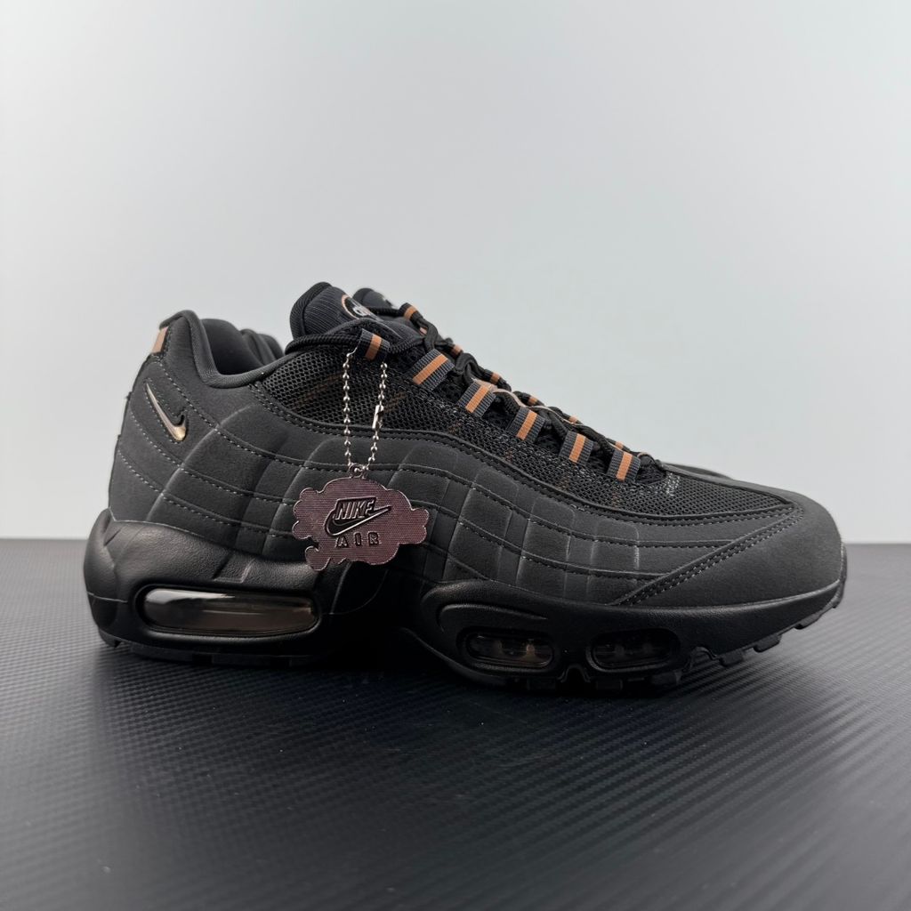 Side profile of the Nike Air Max 95 Central Cee 'Live Yours' sneaker, showcasing the UK drill-inspired dark and metallic layered upper, reflective 3M detailing, exclusive branding, and the signature visible Max Air cushioning units in the black midsole.