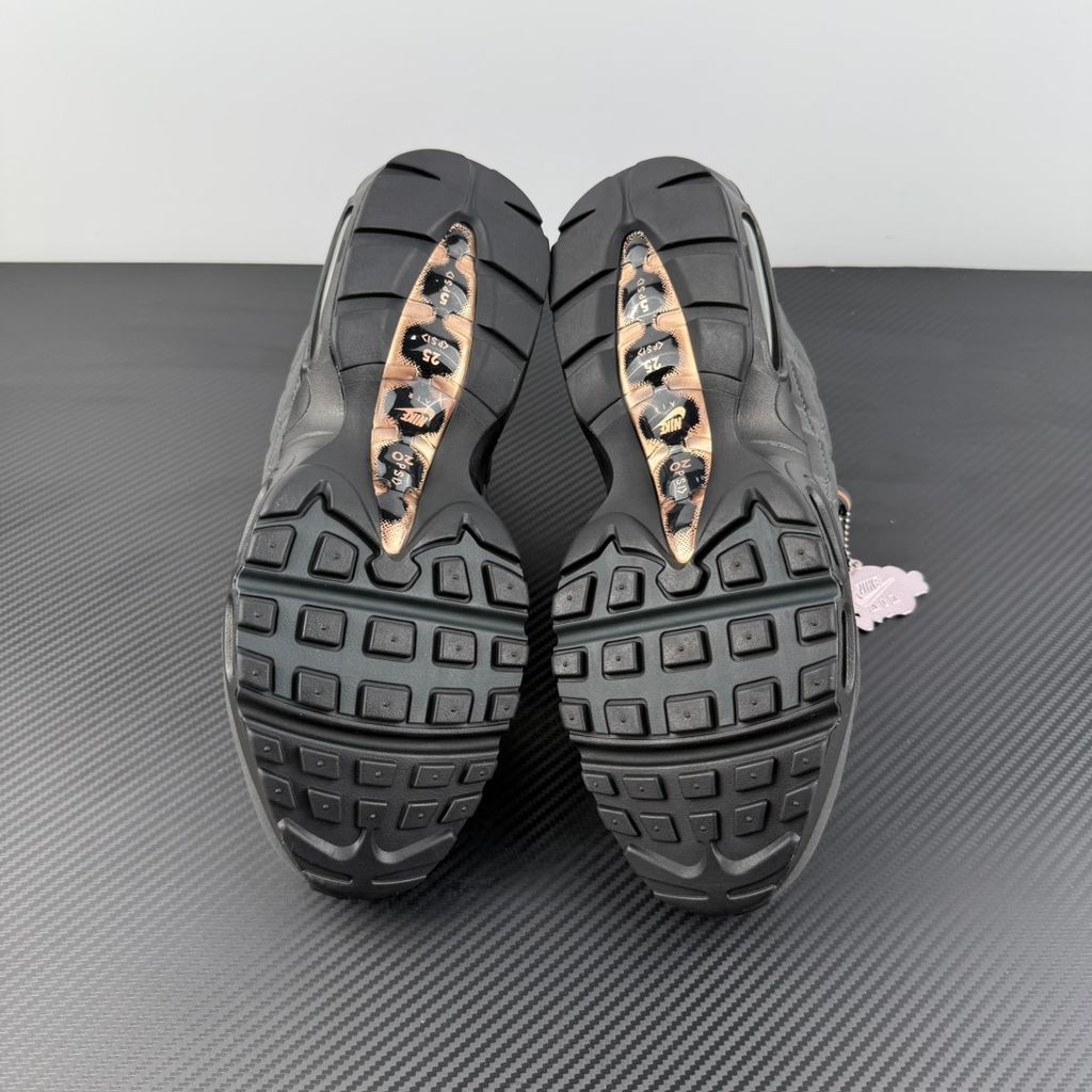 Side profile of the Nike Air Max 95 Central Cee 'Live Yours' sneaker, showcasing the UK drill-inspired dark and metallic layered upper, reflective 3M detailing, exclusive branding, and the signature visible Max Air cushioning units in the black midsole.