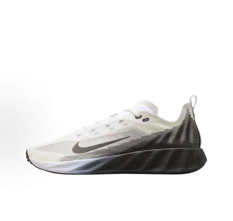 Side profile of the Nike Ava X sneaker in the crisp 'Summit White Black' colorway, showcasing a breathable white mesh upper, sharp contrasting black Swoosh and synthetic overlays, and a sculpted, responsive foam midsole.