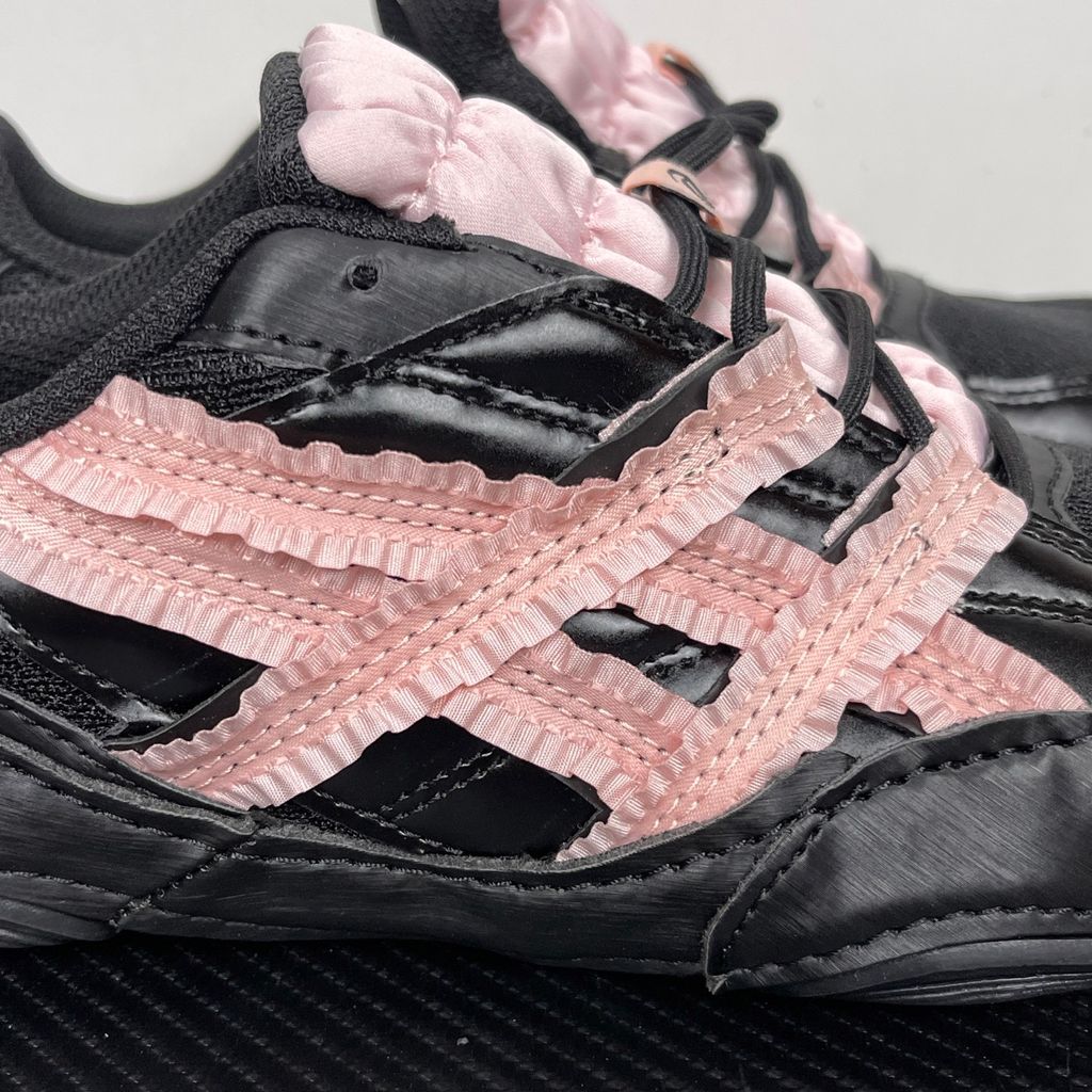 Side profile of the ASICS Hypersync sneaker in the 'Empty Behavior - Black Breeze' colorway, showcasing a stealthy black breathable mesh upper, signature ASICS branding, structural synthetic overlays, and a sleek, supportive midsole.