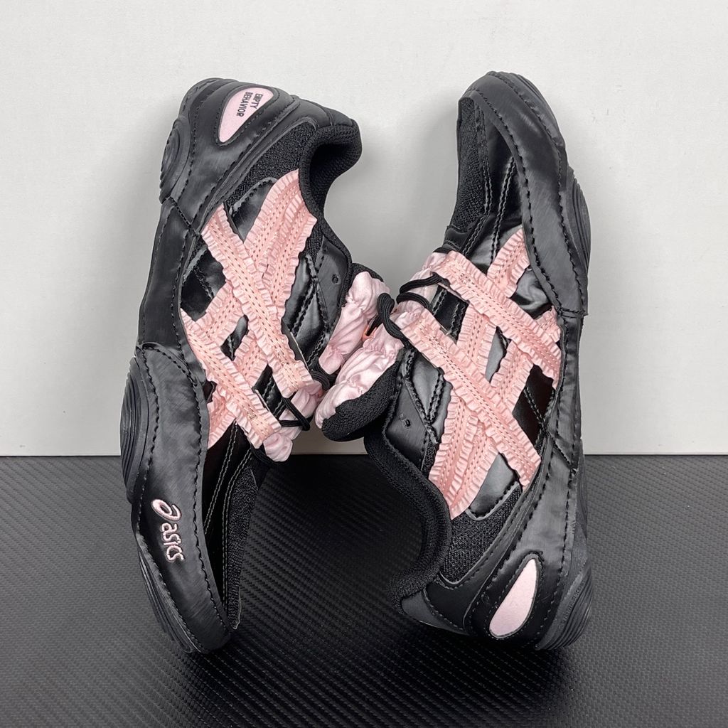 Side profile of the ASICS Hypersync sneaker in the 'Empty Behavior - Black Breeze' colorway, showcasing a stealthy black breathable mesh upper, signature ASICS branding, structural synthetic overlays, and a sleek, supportive midsole.