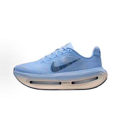 Side profile of the Nike Vomero Premium sneaker in the 'Aluminum' colorway, showcasing the heavily layered breathable mesh upper, cool-toned metallic synthetic overlays, the iconic plastic midfoot cage, and the sculpted Cushlon midsole.