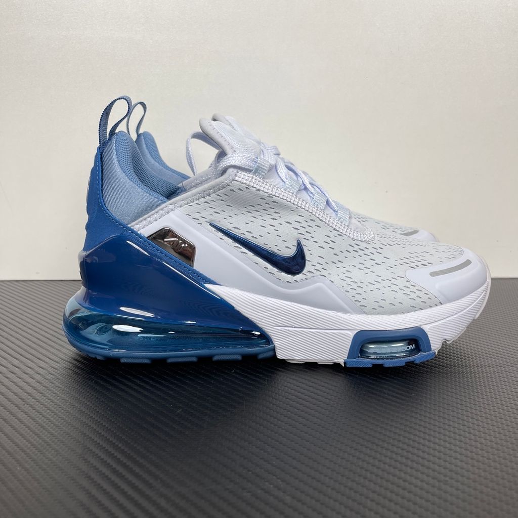 Side profile of the Nike Air Max 270 Premium sneaker in a subtle 'Football Grey' and 'Work Blue' colorway, highlighting the updated breathable premium upper, tonal overlays, and the massive, signature translucent 270-degree Max Air heel unit.