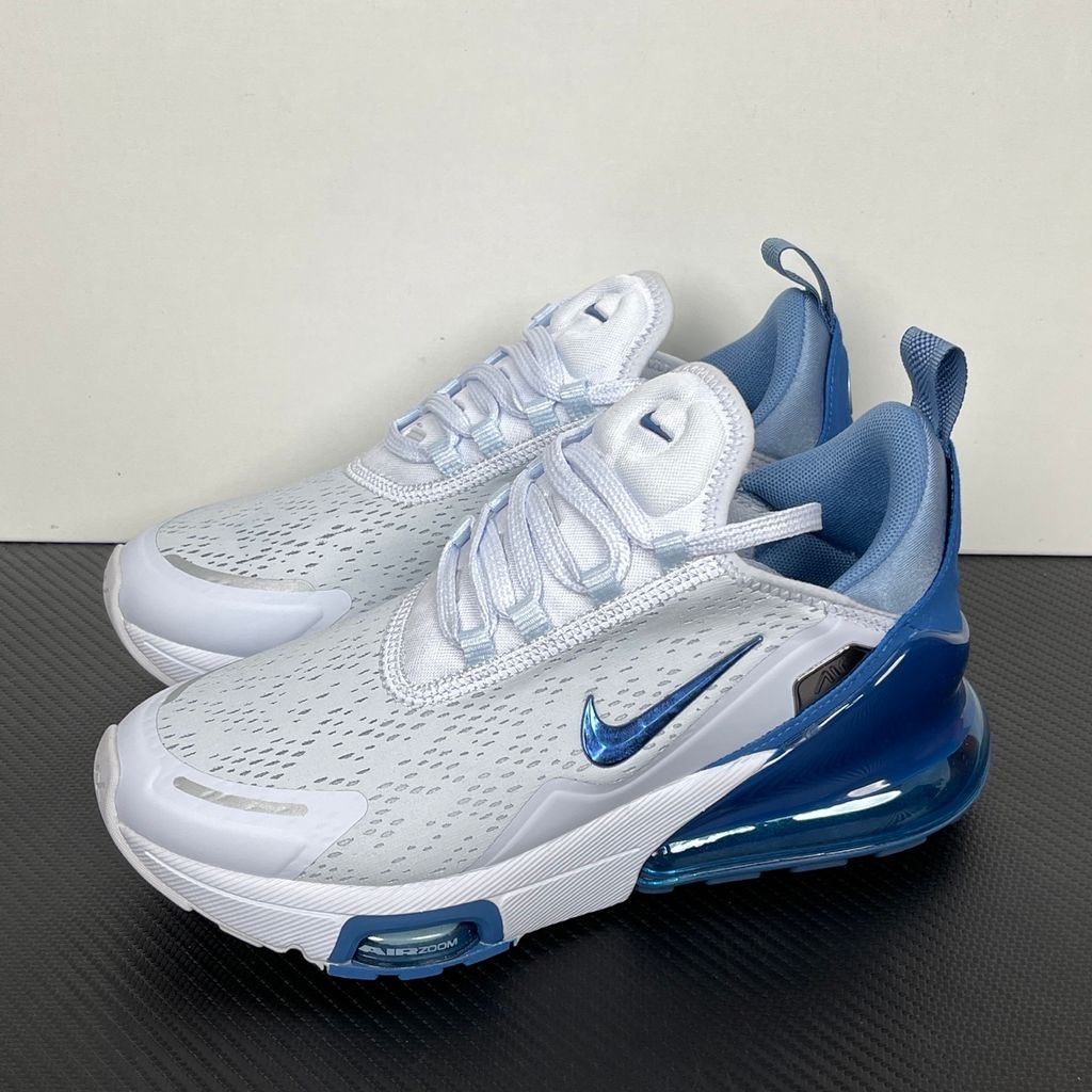 Side profile of the Nike Air Max 270 Premium sneaker in a subtle 'Football Grey' and 'Work Blue' colorway, highlighting the updated breathable premium upper, tonal overlays, and the massive, signature translucent 270-degree Max Air heel unit.