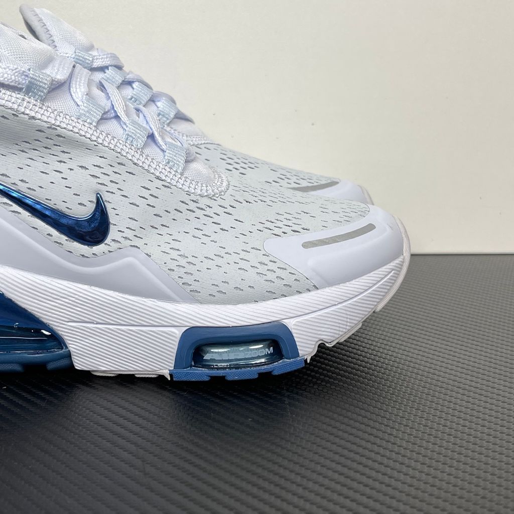 Side profile of the Nike Air Max 270 Premium sneaker in a subtle 'Football Grey' and 'Work Blue' colorway, highlighting the updated breathable premium upper, tonal overlays, and the massive, signature translucent 270-degree Max Air heel unit.