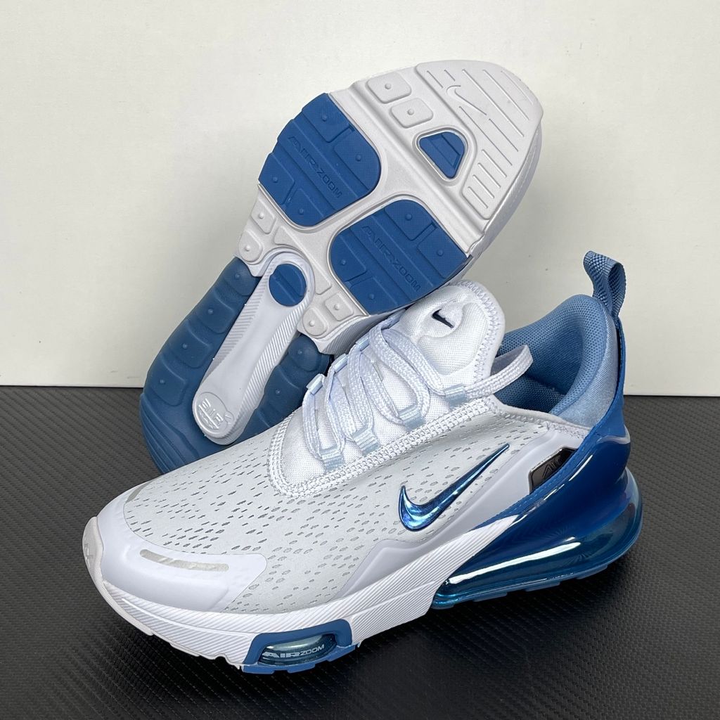 Side profile of the Nike Air Max 270 Premium sneaker in a subtle 'Football Grey' and 'Work Blue' colorway, highlighting the updated breathable premium upper, tonal overlays, and the massive, signature translucent 270-degree Max Air heel unit.